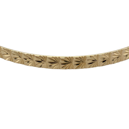 Add timeless elegance to your jewellery collection with this pre-owned 9ct yellow solid gold patterned bangle, featuring classic decorative detailing and versatile everyday appeal—perfect for stacking, gifting, or sophisticated daily wear.

Design: The bangle features an attractive patterned finish that catches the light beautifully, adding texture and character to the classic gold bangle design. Measuring approximately 4mm wide, it offers a refined and elegant appearance.