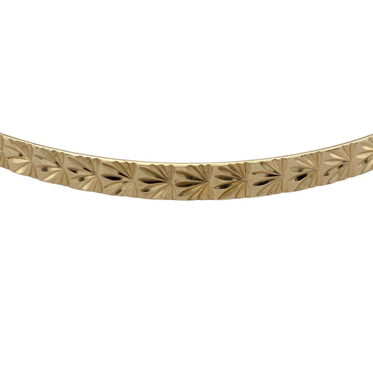 Add timeless elegance to your jewellery collection with this pre-owned 9ct yellow solid gold patterned bangle, featuring classic decorative detailing and versatile everyday appeal—perfect for stacking, gifting, or sophisticated daily wear.

Design: The bangle features an attractive patterned finish that catches the light beautifully, adding texture and character to the classic gold bangle design. Measuring approximately 4mm wide, it offers a refined and elegant appearance.