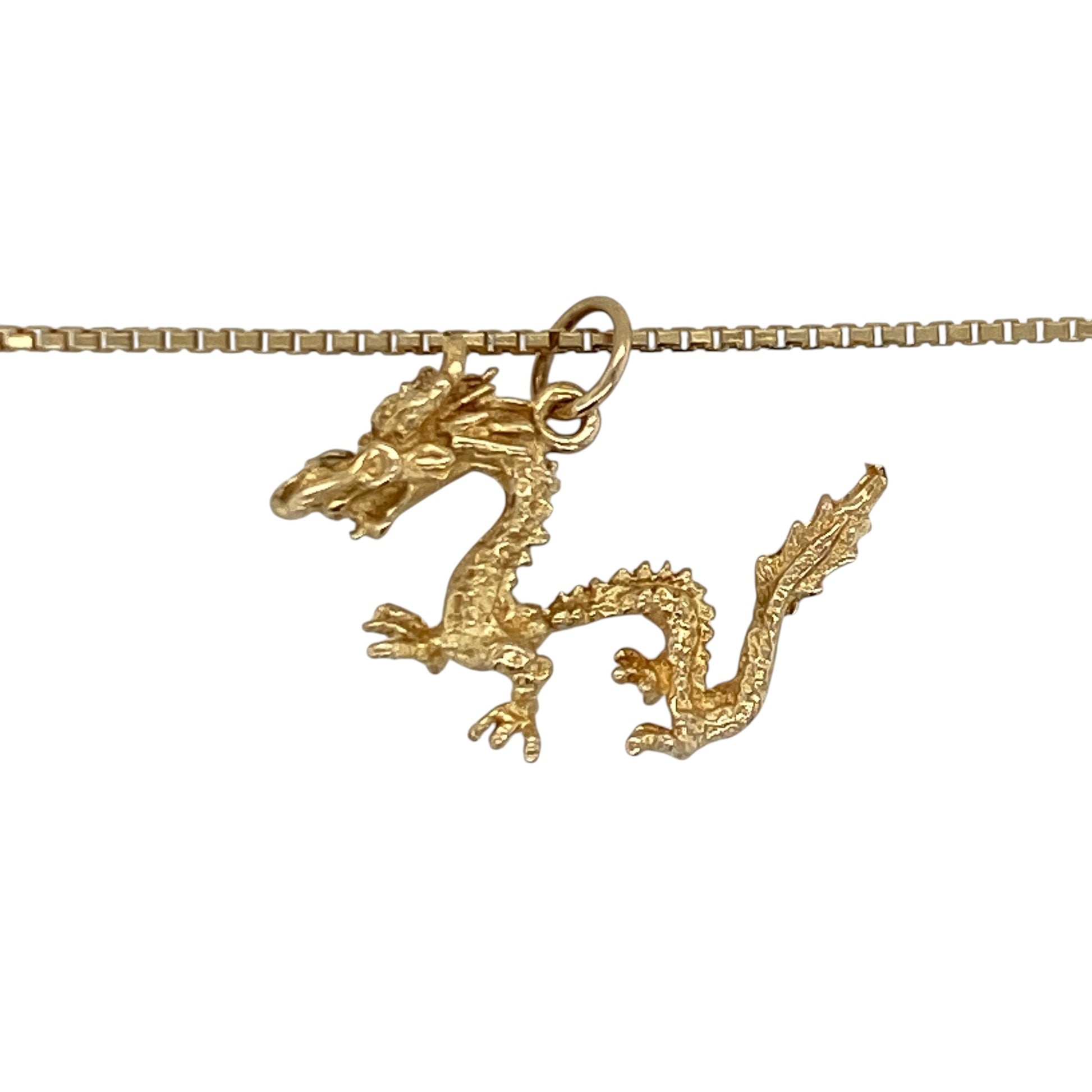 Add bold character and symbolic style to your jewellery collection with this pre-owned 14ct yellow gold dragon pendant necklace, featuring an intricately detailed mythical design with timeless statement appeal—perfect for collectors, gifting, or everyday wear with personality.

Design: The necklace features a detailed dragon pendant measuring approximately 17mm by 23mm, creating a striking focal point with impressive craftsmanship and eye-catching presence.