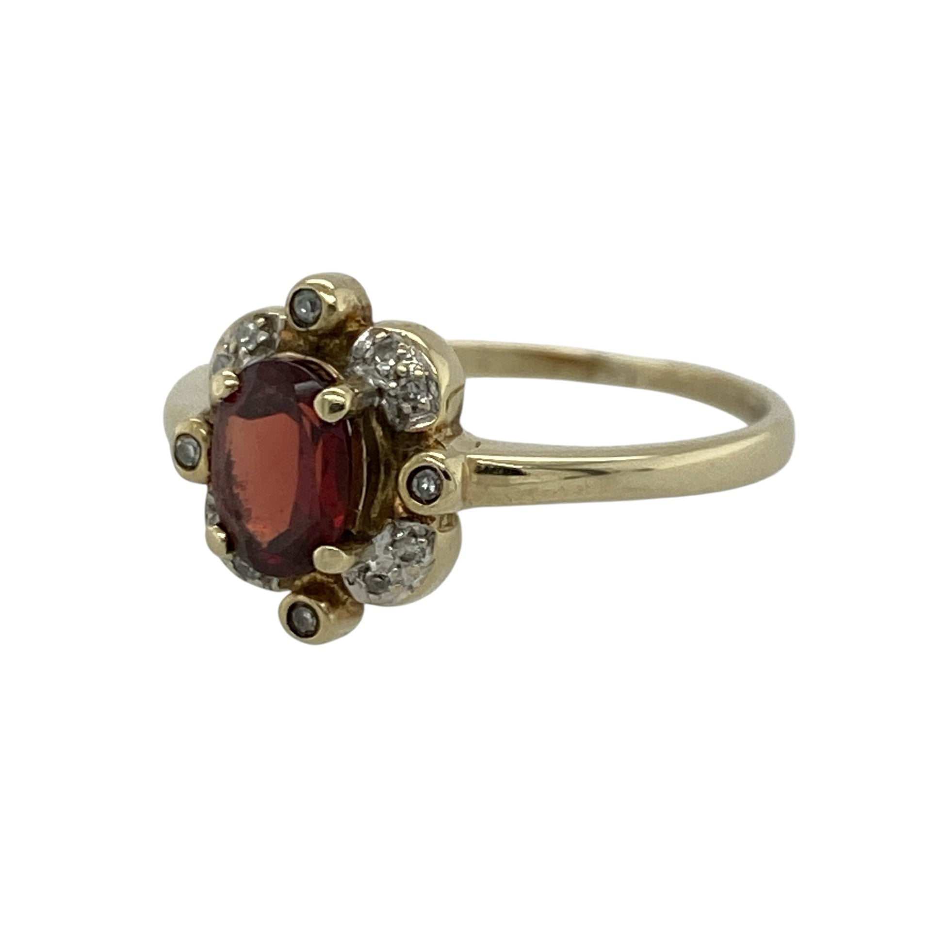 Add rich colour and timeless elegance to your jewellery collection with this pre-owned 9ct yellow gold diamond and garnet ring, featuring a classic gemstone design with refined sparkle and everyday appeal—perfect for special occasions, gifting, or sophisticated daily wear.

Design: The ring showcases a beautiful oval garnet centre stone measuring approximately 7mm by 5mm, complemented by sparkling diamond accents that enhance its rich colour and create an elegant, eye-catching finish.
