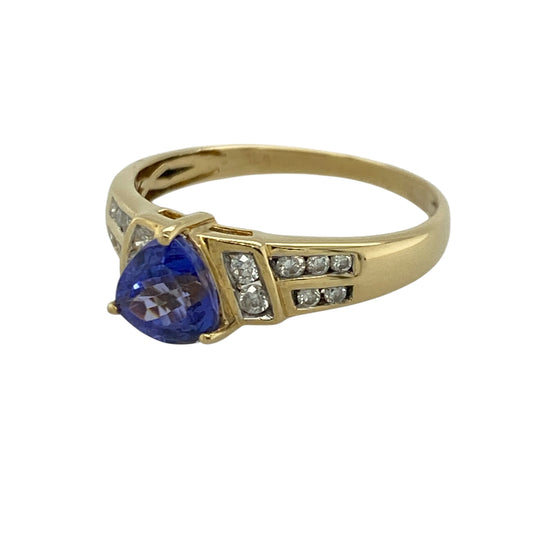 Add vibrant colour and timeless elegance to your jewellery collection with this pre-owned 18ct yellow gold diamond and tanzanite ring, featuring a distinctive gemstone cut with luxurious sparkle and sophisticated appeal—perfect for special occasions, gifting, or refined everyday wear.

Design: The ring showcases a beautiful triangular-cut tanzanite stone measuring approximately 6mm by 6mm by 6mm, creating a unique and eye-catching focal point.