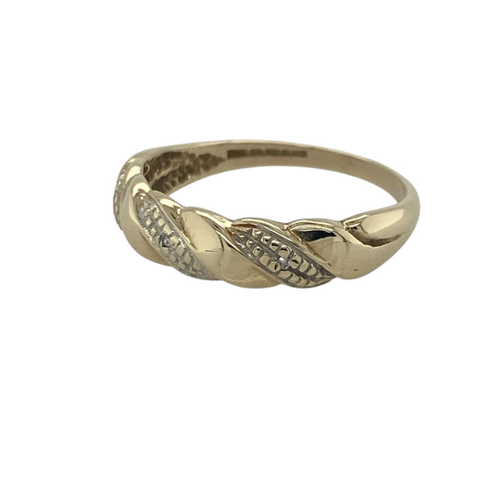 Add timeless sparkle and elegant styling to your jewellery collection with this pre-owned 9ct yellow gold diamond twisted band ring, featuring a graceful flowing design with sophisticated everyday appeal—perfect for special occasions, gifting, or refined daily wear.

Design: The ring features an attractive twisted band design measuring approximately 5mm wide at the front, accented with sparkling diamonds that add brilliance and enhance the elegant flowing lines of the setting.