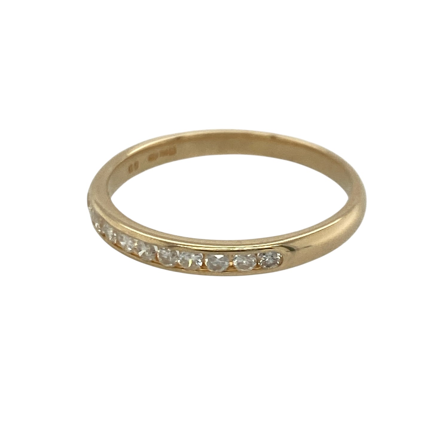 Add timeless sparkle and understated elegance to your jewellery collection with this pre-owned 9ct yellow gold diamond band ring, featuring a sleek channel-set design with refined everyday appeal—perfect for stacking, anniversaries, or sophisticated daily wear.

Design: The ring features a slender 2mm wide band set with sparkling channel-set diamonds, creating a clean and contemporary look with approximately 0.20ct of total diamond content.