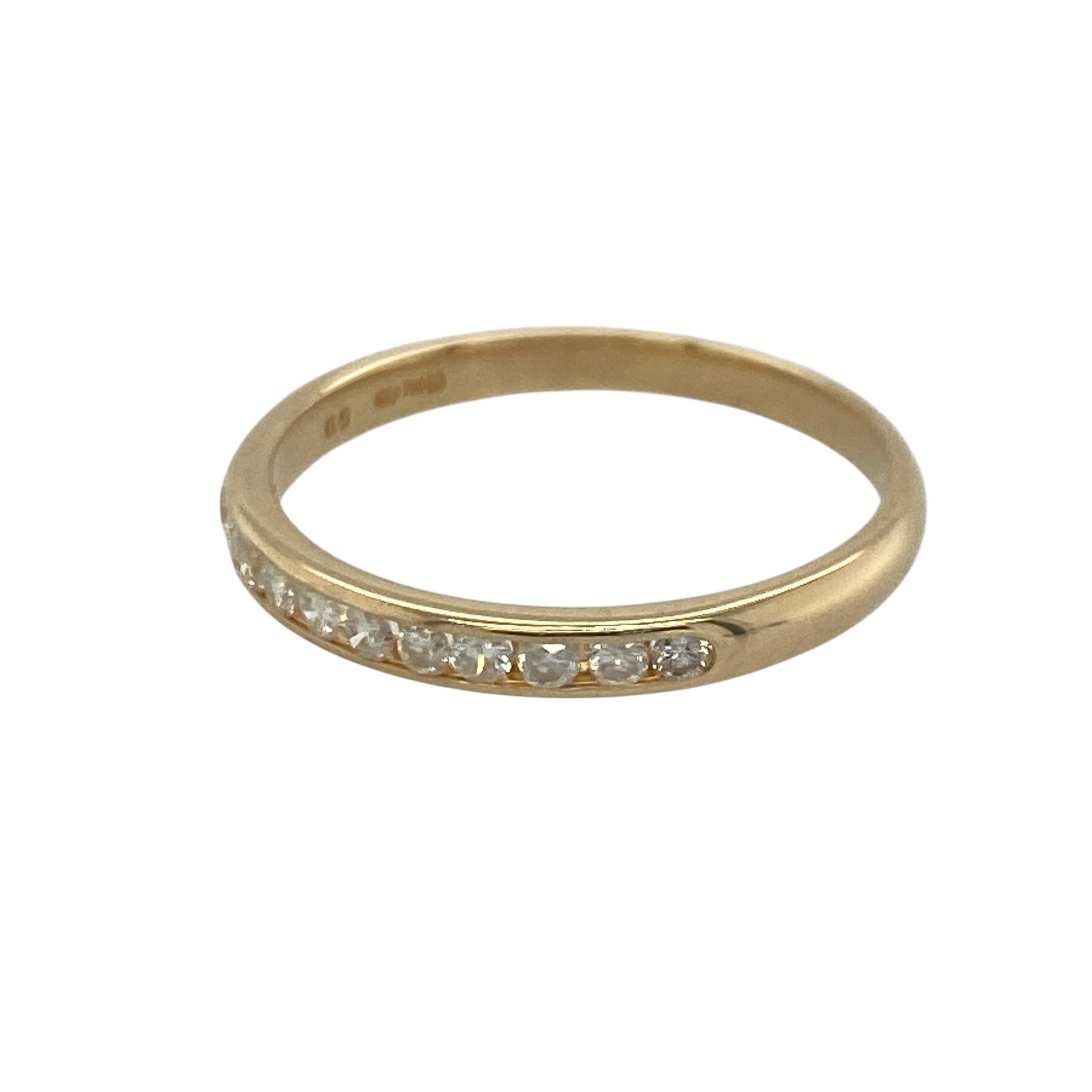 Add timeless sparkle and understated elegance to your jewellery collection with this pre-owned 9ct yellow gold diamond band ring, featuring a sleek channel-set design with refined everyday appeal—perfect for stacking, anniversaries, or sophisticated daily wear.

Design: The ring features a slender 2mm wide band set with sparkling channel-set diamonds, creating a clean and contemporary look with approximately 0.20ct of total diamond content.