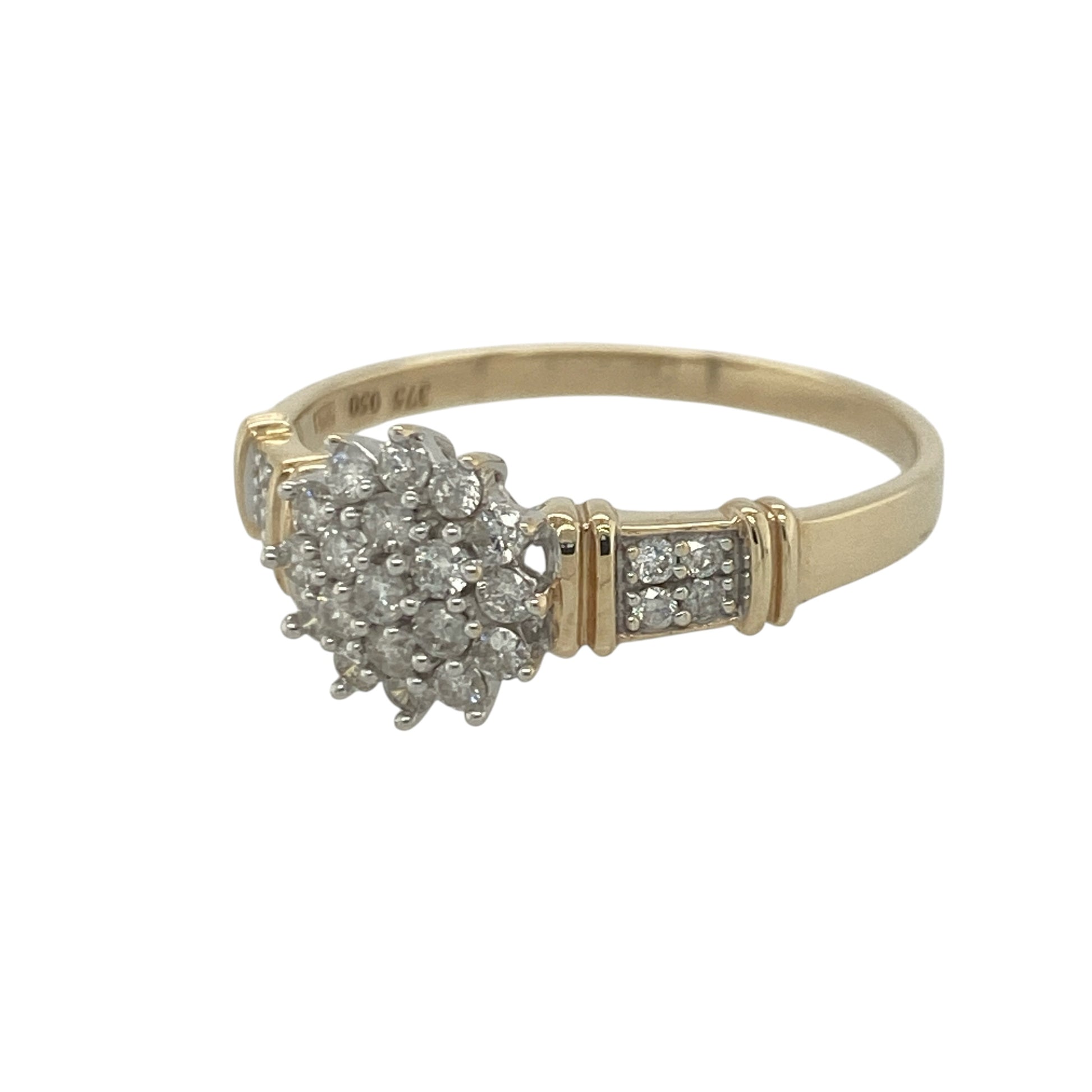 Add exceptional sparkle and timeless elegance to your jewellery collection with this pre-owned 9ct yellow gold diamond cluster ring, featuring diamond-set shoulders and an impressive multi-stone design—perfect for special occasions, gifting, or luxurious everyday wear.

Design: The ring showcases a dazzling diamond cluster centre measuring approximately 9mm high at the front, complemented by sparkling diamond-set shoulders that enhance the overall brilliance of the piece.
