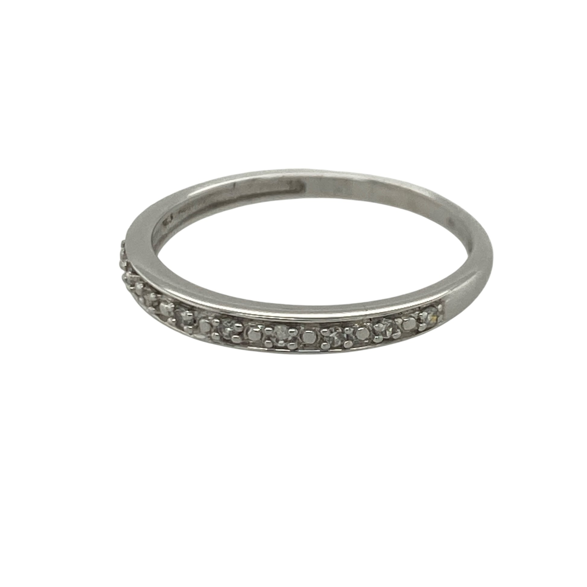 Add timeless sparkle and understated elegance to your jewellery collection with this pre-owned 9ct white gold seven stone diamond band ring, featuring a classic multi-stone design with refined everyday appeal—perfect for stacking, anniversaries, or sophisticated daily wear.

Design: The ring showcases seven sparkling diamonds set across the front of the band, creating a beautifully balanced and elegant display of brilliance.