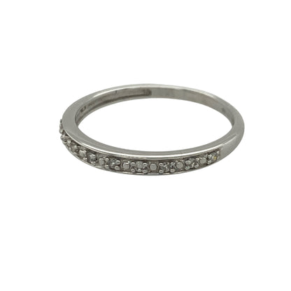 Add timeless sparkle and understated elegance to your jewellery collection with this pre-owned 9ct white gold seven stone diamond band ring, featuring a classic multi-stone design with refined everyday appeal—perfect for stacking, anniversaries, or sophisticated daily wear.

Design: The ring showcases seven sparkling diamonds set across the front of the band, creating a beautifully balanced and elegant display of brilliance.