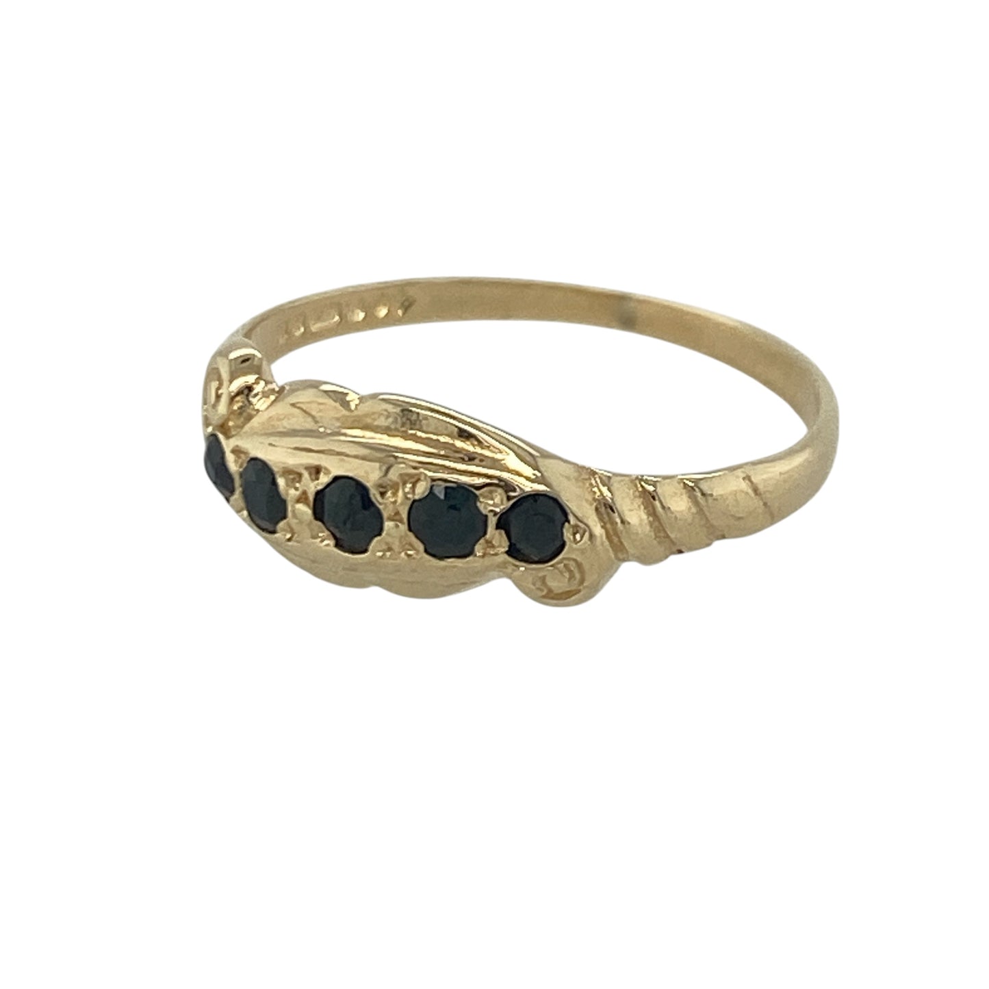 Add vintage-inspired elegance to your jewellery collection with this pre-owned 9ct yellow gold sapphire five stone band ring, featuring intricate scroll detailing and timeless gemstone appeal—perfect for special occasions, gifting, or sophisticated everyday wear.

Design: The ring showcases five beautiful sapphires set across the front of the band, framed by elegant scroll pattern detailing that creates a distinctive vintage-inspired appearance.
