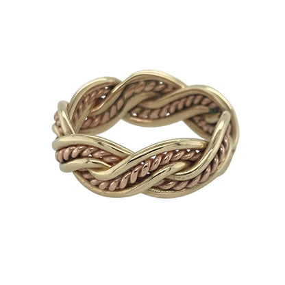 Add a touch of Welsh heritage and timeless elegance to your jewellery collection with this pre-owned 9ct yellow and rose gold Clogau twisted weave band ring, featuring an intricate woven design with sophisticated everyday appeal—perfect for gifting, special occasions, or meaningful daily wear.

Design: The ring features an attractive twisted weave pattern across a substantial 7mm wide band, creating a beautifully textured and eye-catching appearance.