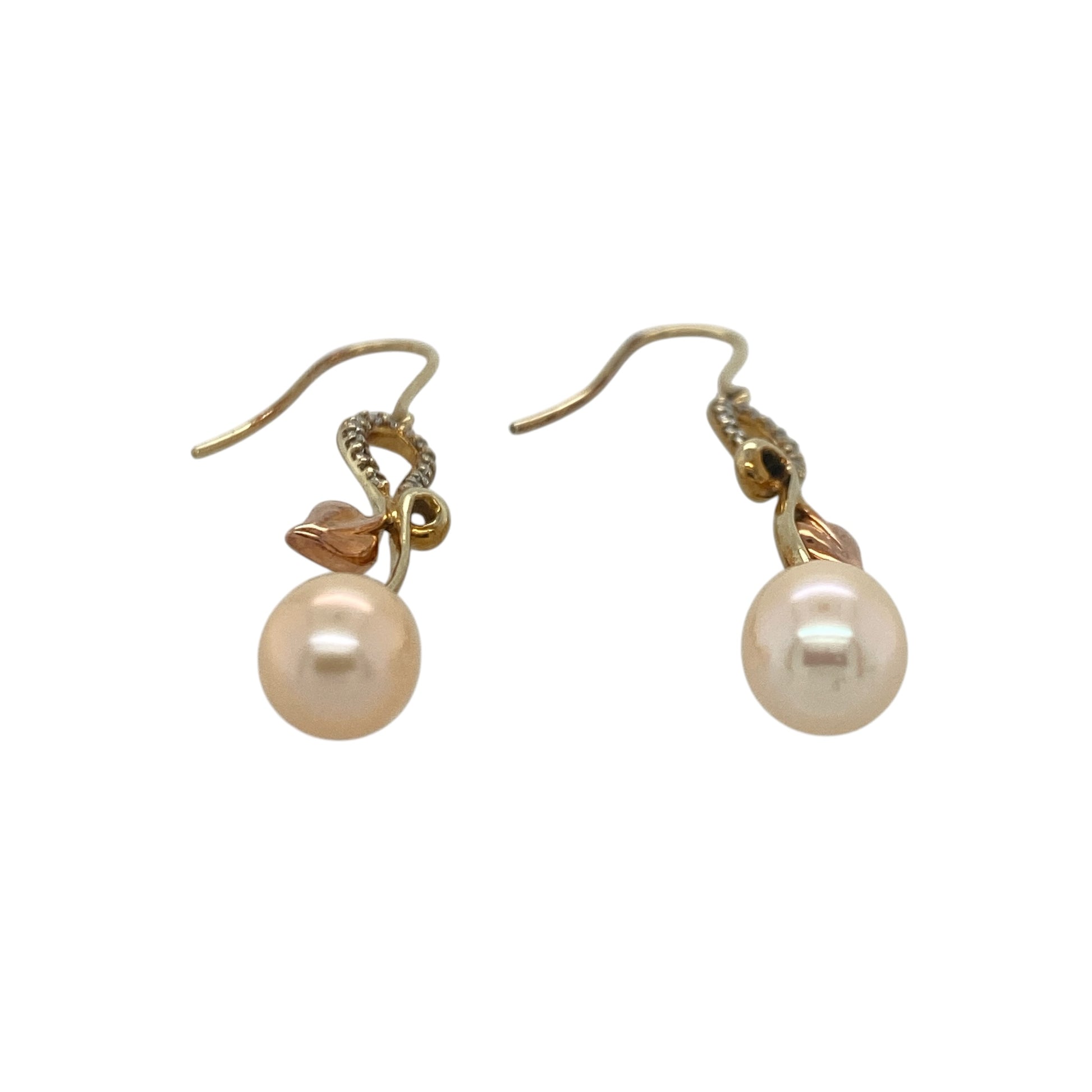 Add a touch of Welsh heritage and timeless elegance to your jewellery collection with these pre-owned 9ct yellow and rose gold Clogau Tree of Life diamond and pearl drop earrings, featuring the iconic Tree of Life design with luxurious gemstone detail—perfect for special occasions, gifting, or sophisticated everyday wear.

Design: The earrings feature Clogau's renowned Tree of Life motif in an elegant drop design