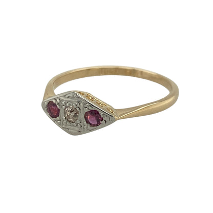 Add vintage-inspired elegance and timeless colour to your jewellery collection with this pre-owned 18ct yellow gold and platinum diamond and ruby ring, featuring a classic three-stone design with enduring sophistication—perfect for special occasions, gifting, or refined everyday wear.

Design: The ring showcases a sparkling central diamond weighing approximately 0.06ct, flanked by a vibrant ruby on either side.