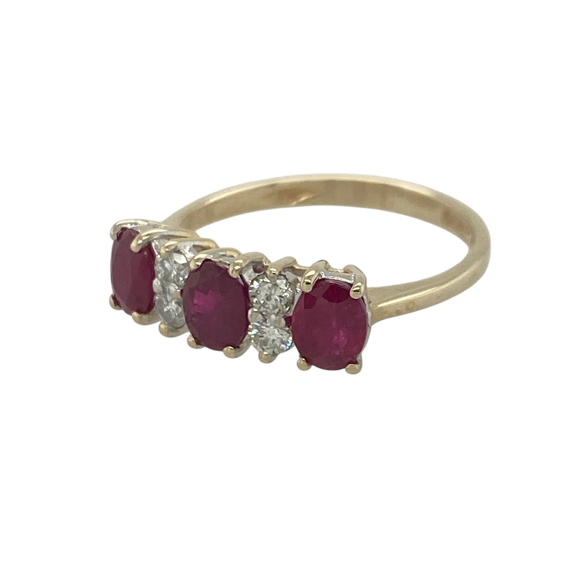 Add rich colour and timeless sparkle to your jewellery collection with this pre-owned 9ct yellow gold diamond and ruby band ring, featuring a classic multi-stone design with elegant everyday appeal—perfect for special occasions, gifting, or sophisticated daily wear.

Design: The ring showcases three beautiful oval rubies, each measuring approximately 5mm by 4mm, arranged across the front of the band.