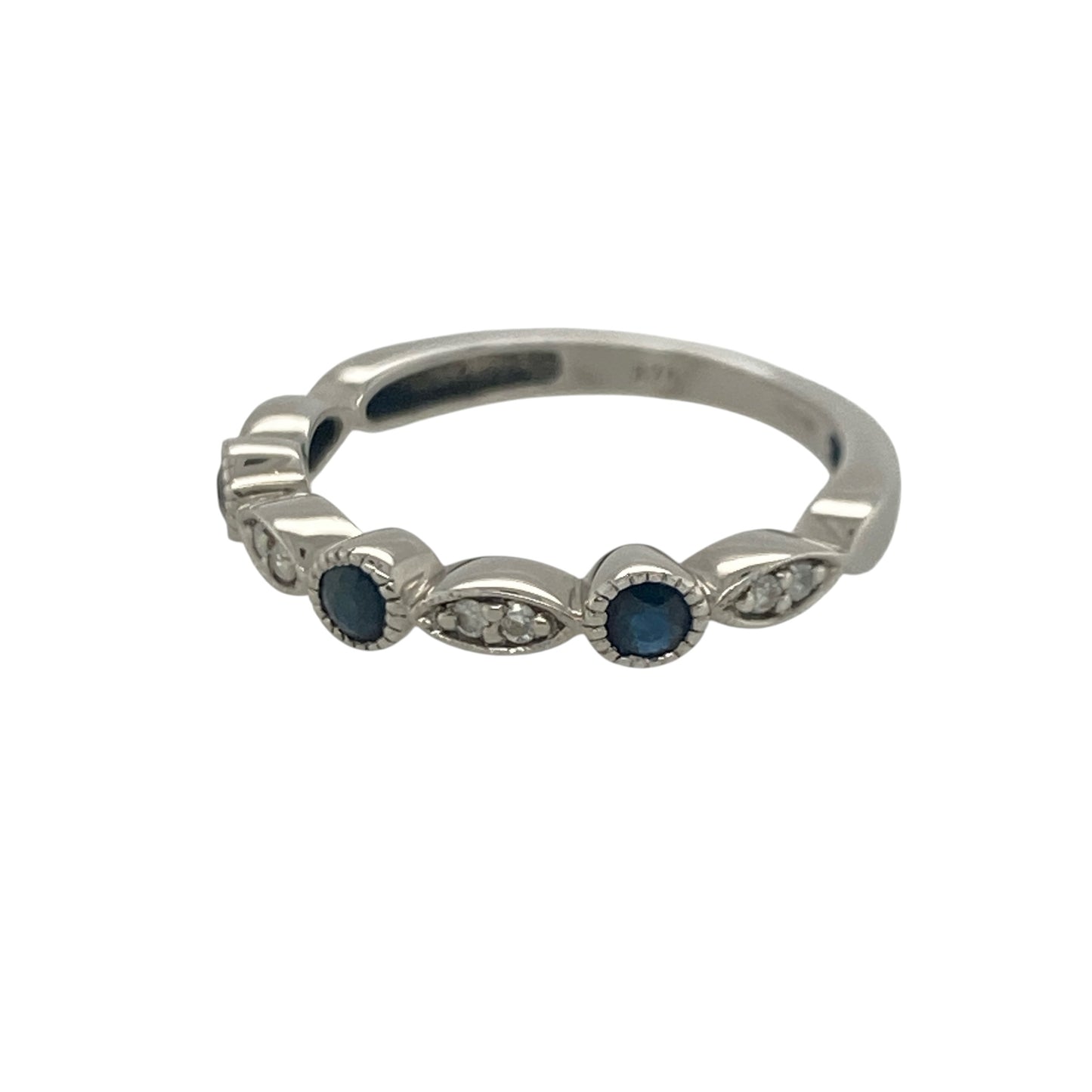 Add timeless elegance and rich colour to your jewellery collection with this pre-owned 9ct white gold diamond and sapphire band ring, featuring a classic gemstone design with refined everyday appeal—perfect for special occasions, gifting, or sophisticated daily wear.

Design: The ring features a beautifully balanced arrangement of sparkling diamonds and vibrant sapphires across the front of the band, creating an elegant display of colour and brilliance.
