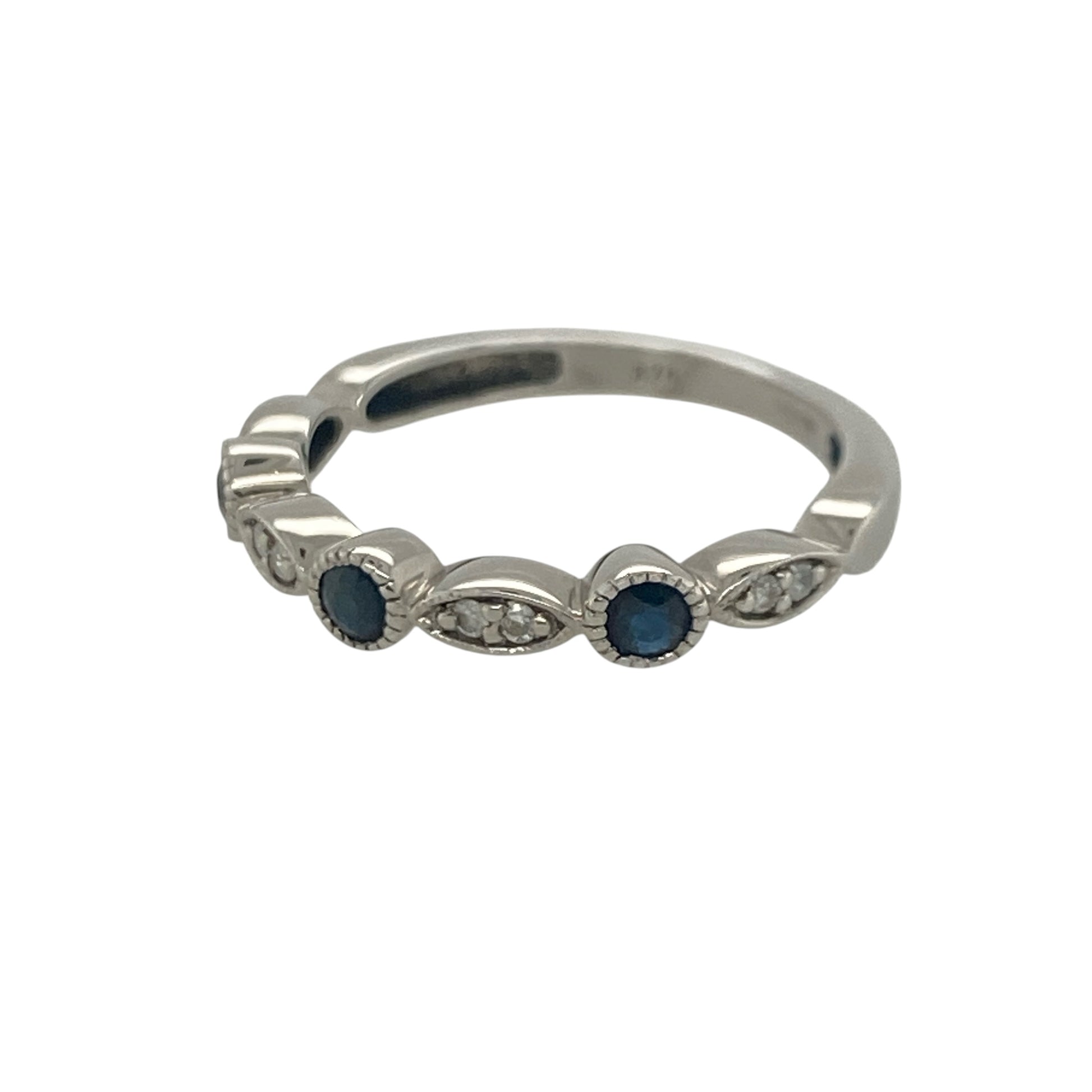 Add timeless elegance and rich colour to your jewellery collection with this pre-owned 9ct white gold diamond and sapphire band ring, featuring a classic gemstone design with refined everyday appeal—perfect for special occasions, gifting, or sophisticated daily wear.

Design: The ring features a beautifully balanced arrangement of sparkling diamonds and vibrant sapphires across the front of the band, creating an elegant display of colour and brilliance.