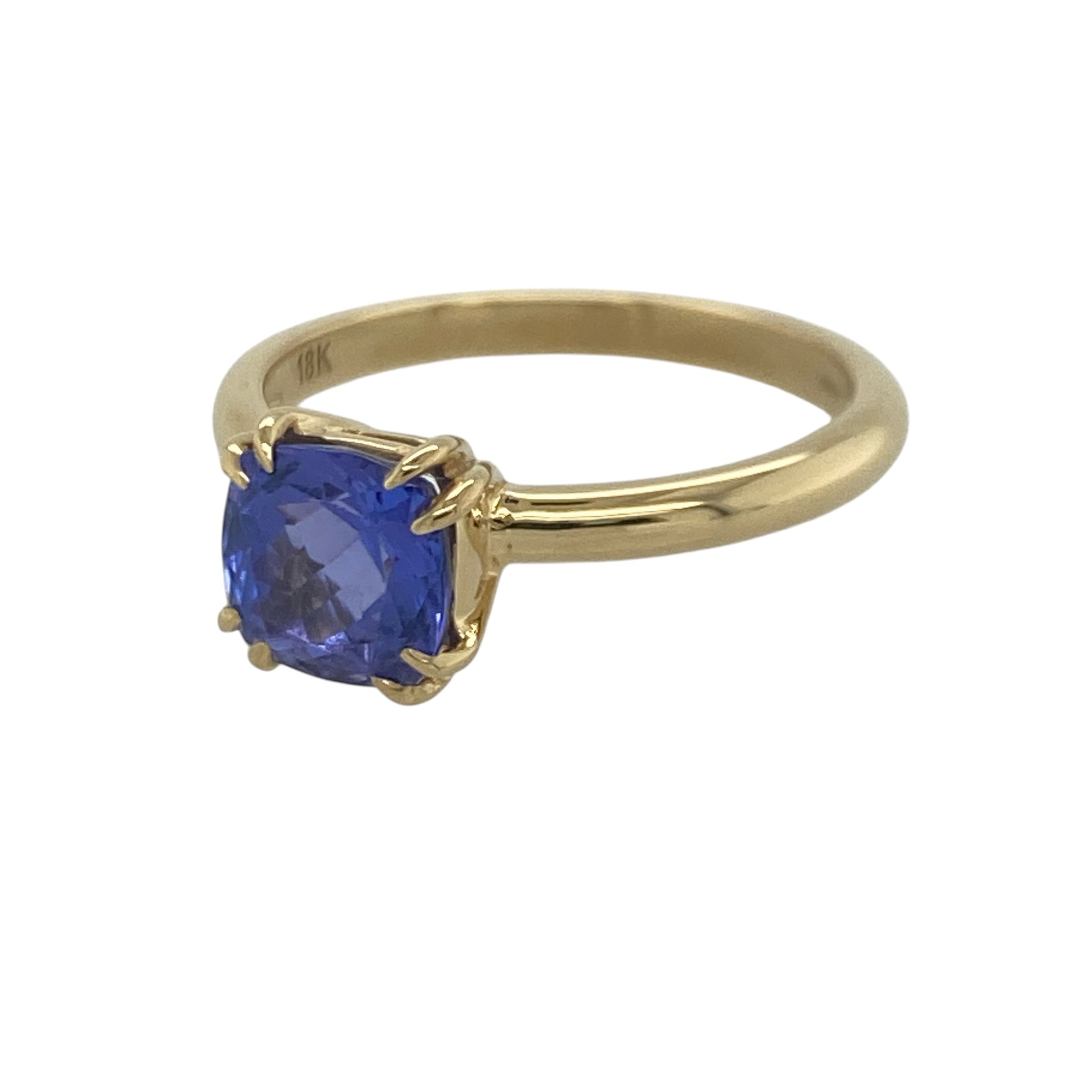 Add exceptional colour and timeless elegance to your jewellery collection with this pre-owned 18ct yellow gold tanzanite solitaire ring, featuring a striking single-stone design with luxurious everyday appeal—perfect for special occasions, gifting, or sophisticated daily wear.

Design: The ring showcases a beautiful cushion-cut tanzanite measuring approximately 7mm by 7mm, creating a stunning focal point with its captivating violet-blue tones.