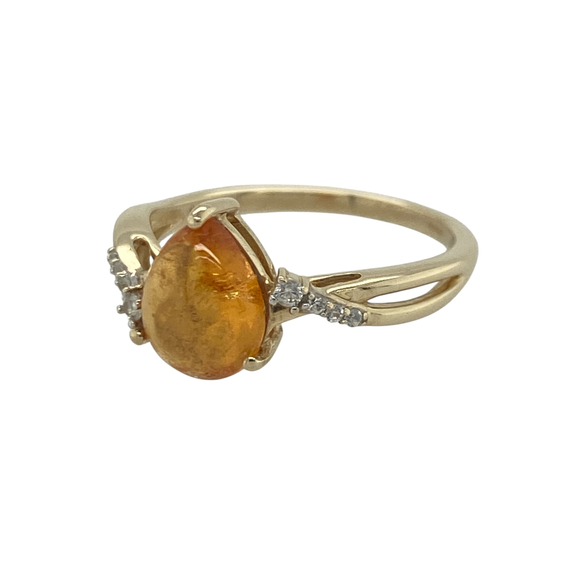Add warm colour and elegant sparkle to your jewellery collection with this pre-owned 9ct yellow gold amber-coloured stone and cubic zirconia ring, featuring a graceful teardrop design with timeless everyday appeal—perfect for special occasions, gifting, or refined daily wear.

Design: The ring showcases a beautiful teardrop-shaped amber-coloured stone measuring approximately 9mm by 7mm, creating a striking focal point with its warm golden hues.
