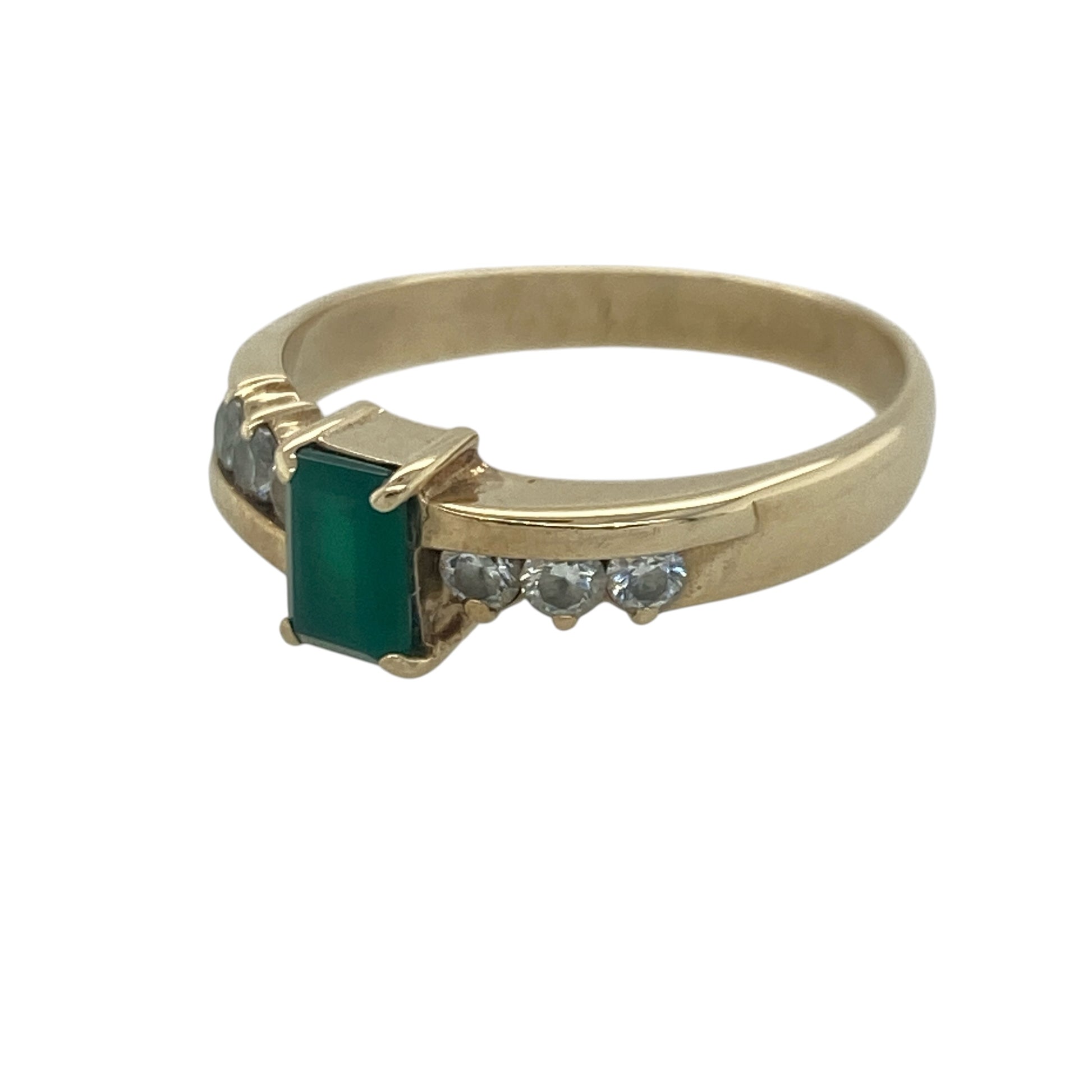 Add vibrant colour and elegant sparkle to your jewellery collection with this pre-owned 9ct yellow gold green stone and cubic zirconia ring, featuring a classic gemstone design with sophisticated everyday appeal—perfect for special occasions, gifting, or refined daily wear.

Design: The ring showcases a beautiful rectangular emerald-coloured green stone measuring approximately 6mm by 4mm, creating a striking focal point with rich colour and timeless elegance.