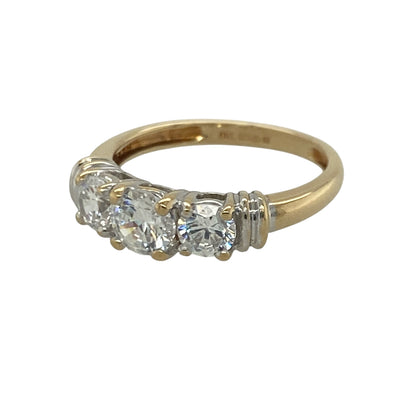 Add timeless elegance and brilliant sparkle to your jewellery collection with this pre-owned 18ct yellow gold cubic zirconia trilogy ring, featuring a classic three-stone design with sophisticated everyday appeal—perfect for special occasions, gifting, or refined daily wear.

Design: The ring showcases a sparkling round centre stone measuring approximately 5mm in diameter, flanked by two round cubic zirconia stones measuring approximately 4mm in diameter each.