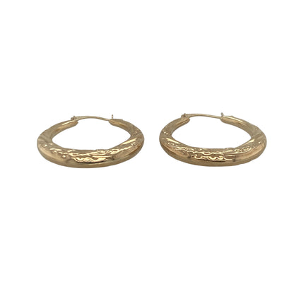 Add timeless elegance and subtle texture to your jewellery collection with these pre-owned 9ct yellow gold patterned hoop creole earrings, featuring a classic design with versatile everyday appeal—perfect for gifting, daily wear, or effortless styling.

Design: The earrings feature a traditional hoop creole design enhanced with attractive patterned detailing that catches the light beautifully. The textured finish adds extra character and sparkle while maintaining the timeless appeal of classic gold hoops.