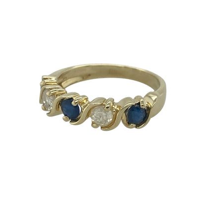 Add timeless elegance and rich colour to your jewellery collection with this pre-owned 14ct yellow gold diamond and sapphire band ring, featuring a classic five-stone design with enduring sophistication—perfect for special occasions, gifting, or refined everyday wear.

Design: The ring showcases three vibrant sapphires, each measuring approximately 4mm in diameter, alternating with two sparkling diamonds to create a beautifully balanced and eye-catching arrangement across the band.