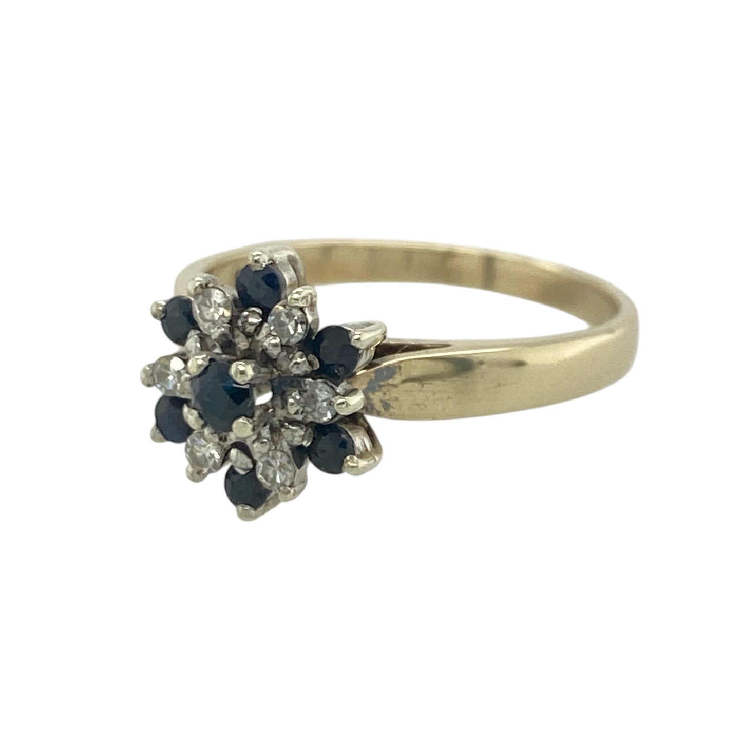 Add timeless elegance and rich colour to your jewellery collection with this pre-owned 9ct yellow gold diamond and sapphire flower cluster ring, featuring a beautiful floral-inspired design with classic everyday appeal—perfect for special occasions, gifting, or refined daily wear.

Design: The ring showcases a striking flower cluster design measuring approximately 11mm high at the front, combining vibrant sapphires and sparkling diamonds to create a beautifully balanced floral display.