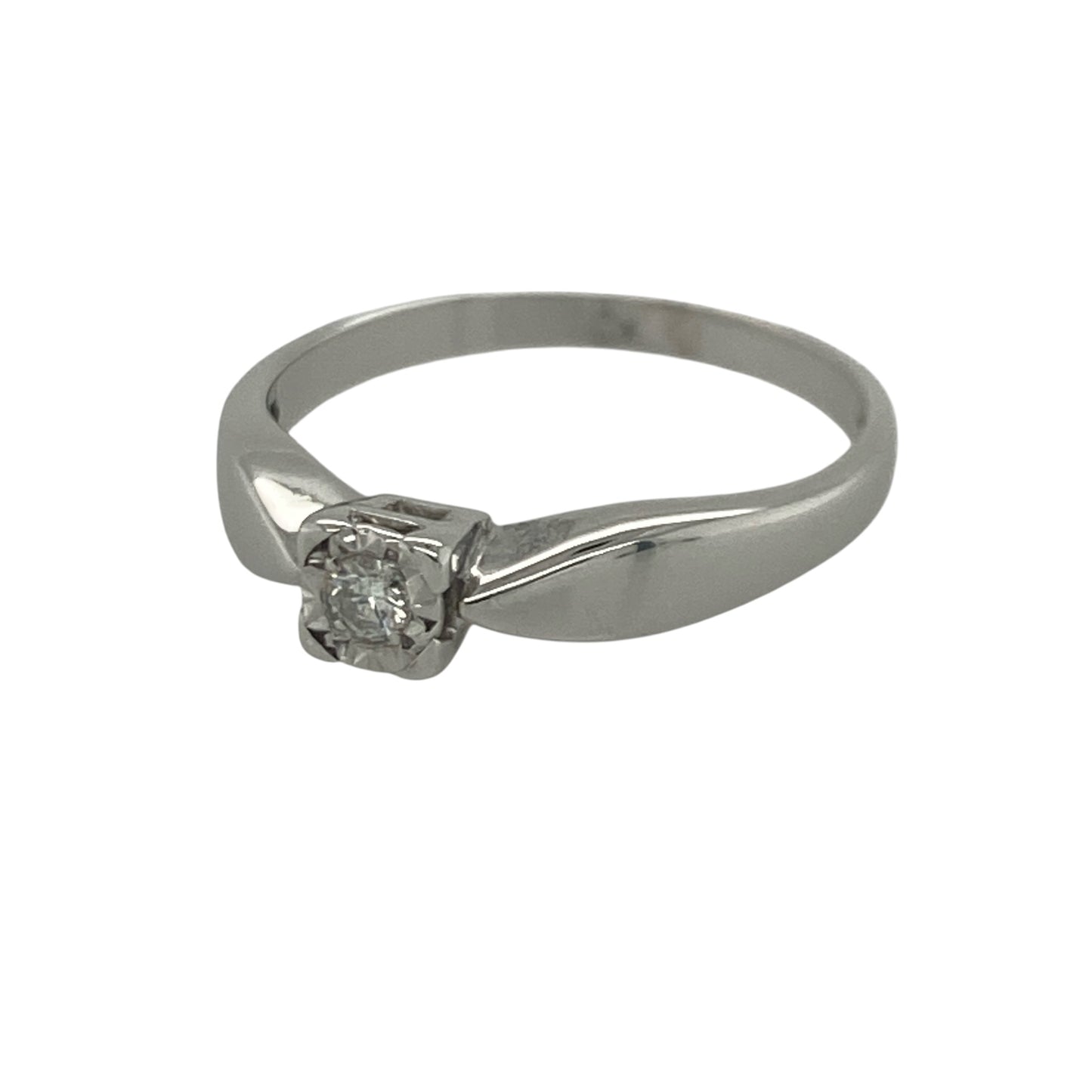 Add timeless sparkle and elegant sophistication to your jewellery collection with this pre-owned 9ct white gold diamond solitaire ring, featuring a classic design with refined everyday appeal—perfect for special occasions, gifting, or as a meaningful token of love.

Design: The ring showcases a brilliant cut diamond weighing approximately 0.08ct, presented in a square illusion setting that enhances the appearance of the stone and maximises its sparkle.