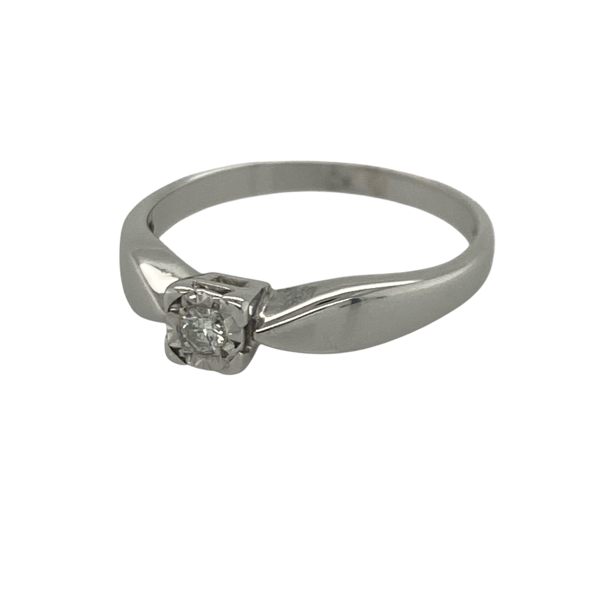Add timeless sparkle and elegant sophistication to your jewellery collection with this pre-owned 9ct white gold diamond solitaire ring, featuring a classic design with refined everyday appeal—perfect for special occasions, gifting, or as a meaningful token of love.

Design: The ring showcases a brilliant cut diamond weighing approximately 0.08ct, presented in a square illusion setting that enhances the appearance of the stone and maximises its sparkle.