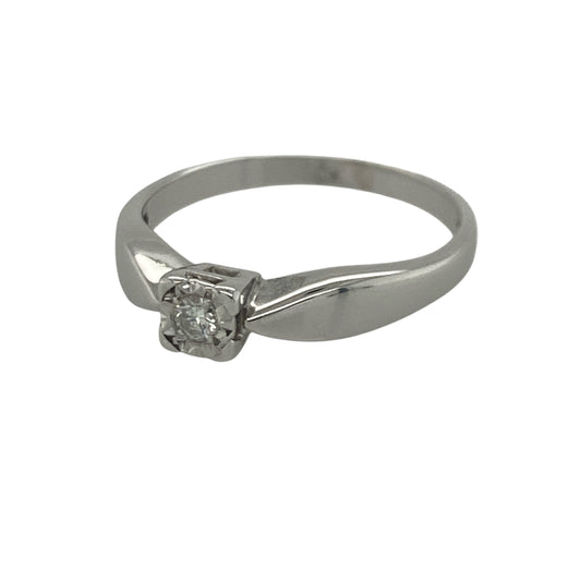 Add timeless sparkle and elegant sophistication to your jewellery collection with this pre-owned 9ct white gold diamond solitaire ring, featuring a classic design with refined everyday appeal—perfect for special occasions, gifting, or as a meaningful token of love.

Design: The ring showcases a brilliant cut diamond weighing approximately 0.08ct, presented in a square illusion setting that enhances the appearance of the stone and maximises its sparkle.