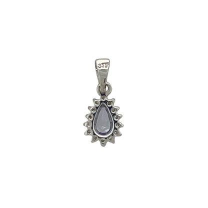 Add a touch of elegant colour and sparkle to your jewellery collection with this pre-owned 9ct white gold diamond and tanzanite teardrop cluster pendant, featuring a graceful gemstone design with timeless everyday appeal—perfect for gifting, special occasions, or refined daily wear.

Design: The pendant showcases a beautiful teardrop-shaped tanzanite measuring approximately 5mm by 3mm, surrounded by a cluster of sparkling diamonds that enhance its captivating violet-blue tones.