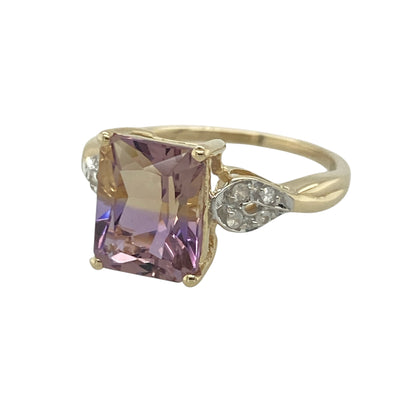 Add captivating colour and elegant sparkle to your jewellery collection with this pre-owned 9ct yellow gold ametrine and cubic zirconia ring, featuring a striking gemstone design with sophisticated everyday appeal—perfect for special occasions, gifting, or statement wear.

Design: The ring showcases a beautiful rectangular ametrine measuring approximately 10mm by 8mm, creating a bold and eye-catching focal point.