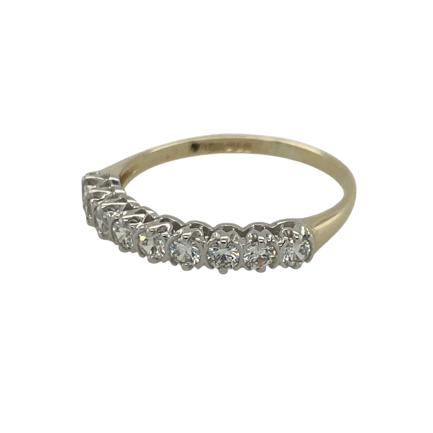 Add timeless sparkle and elegant simplicity to your jewellery collection with this pre-owned 9ct yellow gold cubic zirconia band ring, featuring a classic design with versatile everyday appeal—perfect for special occasions, gifting, stacking, or daily wear.

Design: The ring features a row of sparkling cubic zirconia stones, each measuring approximately 3mm in diameter, creating a beautiful display of brilliance across the band.