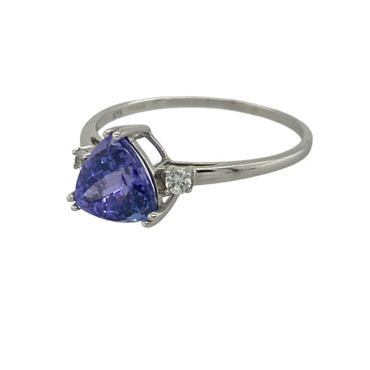 Add captivating colour and elegant sparkle to your jewellery collection with this pre-owned 9ct white gold tanzanite and cubic zirconia ring, featuring a distinctive gemstone design with sophisticated everyday appeal—perfect for special occasions, gifting, or refined daily wear.

Design: The ring showcases a beautiful triangle-cut tanzanite measuring approximately 7mm by 7mm by 7mm, creating a striking focal point with its vibrant violet-blue tones. 
