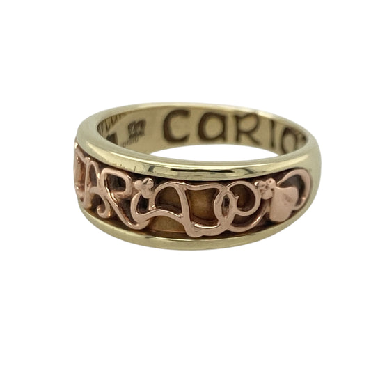 Add a touch of Welsh heritage and timeless romance to your jewellery collection with this pre-owned 9ct yellow and rose gold Clogau Cariad band ring, featuring an iconic design with elegant everyday appeal—perfect for gifting, anniversaries, or meaningful daily wear.

Design: The ring features the distinctive Cariad design across a substantial 7mm wide band, creating a striking and instantly recognisable look. 