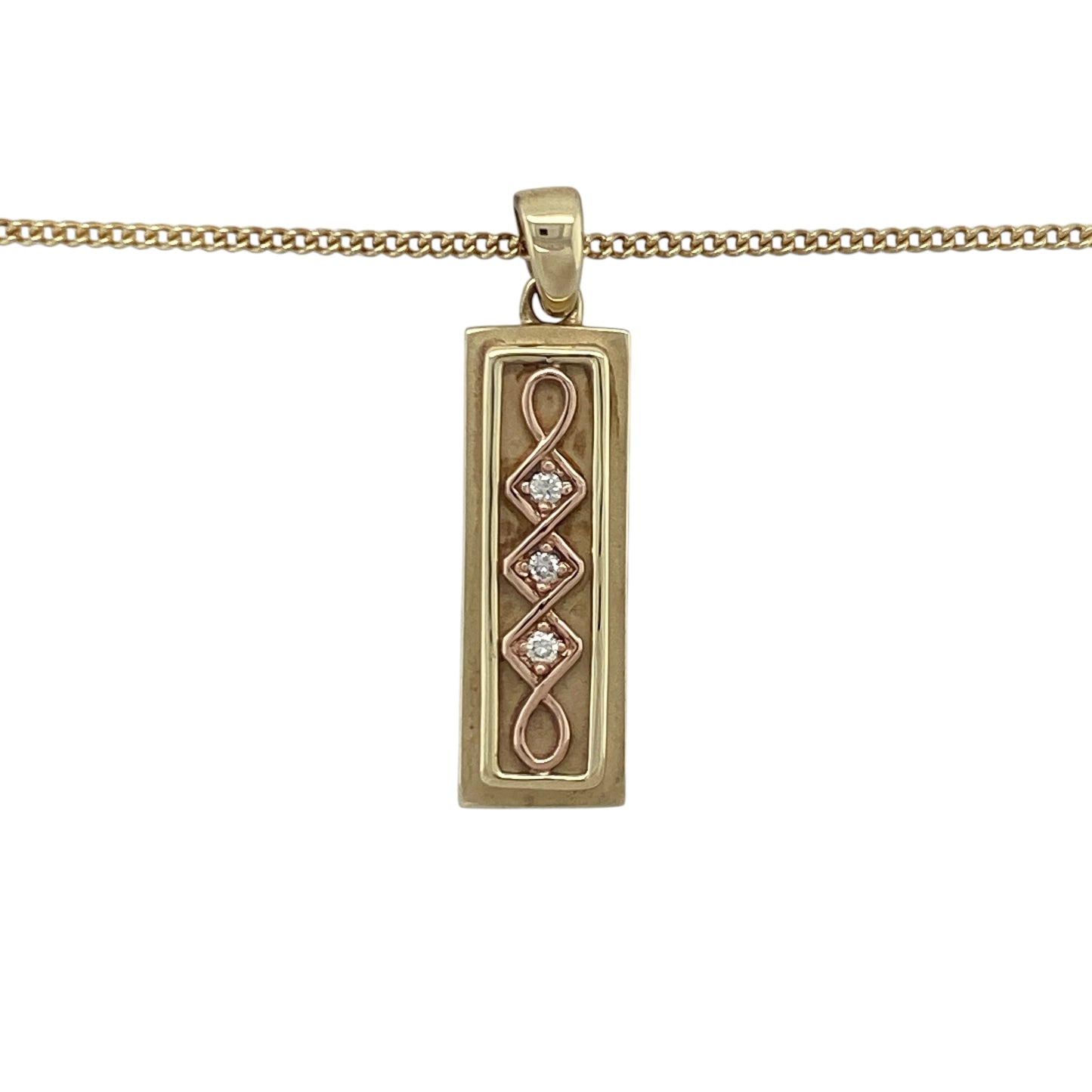 Celebrate heritage and luxury with this pre-owned 9ct yellow and rose gold diamond set Celtic Clogau ingot pendant—rich in symbolism, beautifully detailed, and crafted as a limited edition piece.

Design: This striking 3.2cm long pendant features a classic ingot shape adorned with an intricate Celtic design in warm rose gold, accented by approximately 6 points of sparkling diamonds for added brilliance.