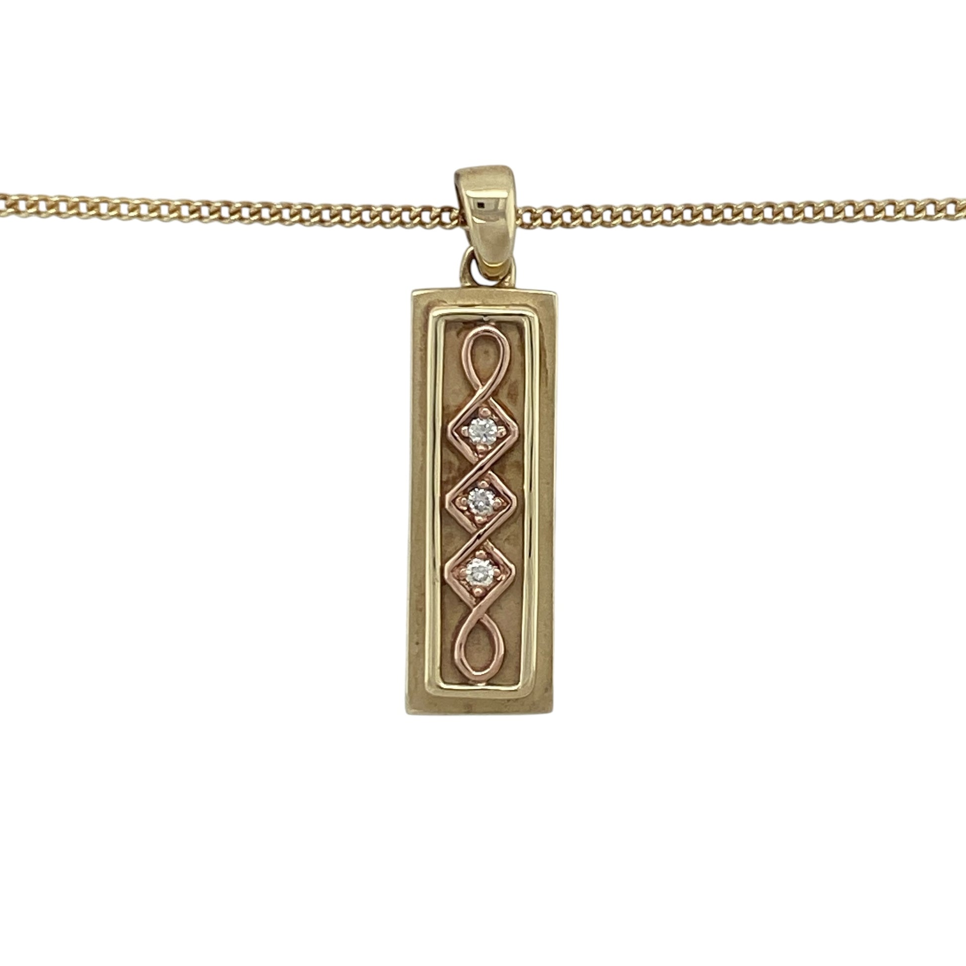 Celebrate heritage and luxury with this pre-owned 9ct yellow and rose gold diamond set Celtic Clogau ingot pendant—rich in symbolism, beautifully detailed, and crafted as a limited edition piece.

Design: This striking 3.2cm long pendant features a classic ingot shape adorned with an intricate Celtic design in warm rose gold, accented by approximately 6 points of sparkling diamonds for added brilliance.