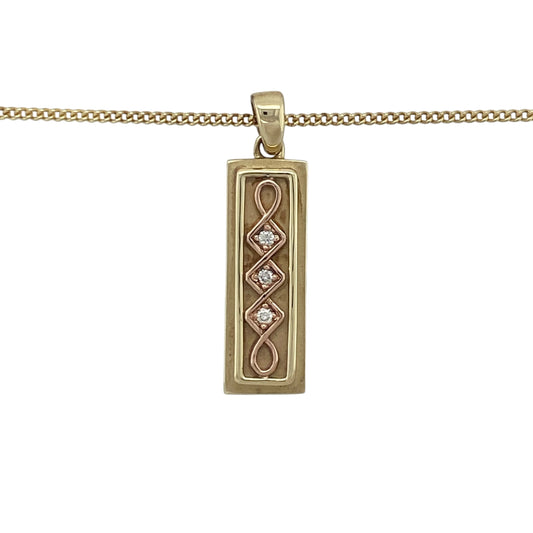 Celebrate heritage and luxury with this pre-owned 9ct yellow and rose gold diamond set Celtic Clogau ingot pendant—rich in symbolism, beautifully detailed, and crafted as a limited edition piece.

Design: This striking 3.2cm long pendant features a classic ingot shape adorned with an intricate Celtic design in warm rose gold, accented by approximately 6 points of sparkling diamonds for added brilliance.