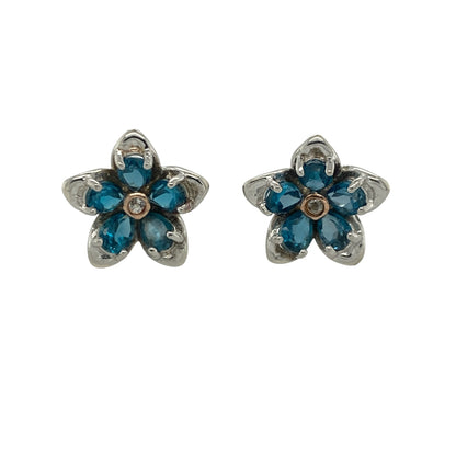 Add a touch of Welsh-inspired elegance and floral beauty to your jewellery collection with these pre-owned sterling silver, rose gold and blue stone Clogau flower stud earrings, featuring a charming design with timeless everyday appeal—perfect for gifting, special occasions, or refined daily wear.

Design: The earrings showcase a beautifully crafted flower design accented with striking blue stones, creating an eye-catching contrast of colour and sparkle.