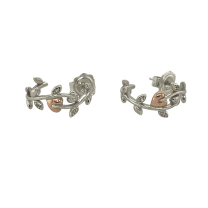 Add a touch of Welsh heritage and elegant sparkle to your jewellery collection with these pre-owned sterling silver, 9ct rose gold and white topaz Clogau Tree of Life half hoop earrings, featuring a beautifully symbolic design with timeless everyday appeal—perfect for gifting, special occasions, or refined daily wear.

Design: The earrings feature the iconic Tree of Life motif incorporated into an elegant half hoop design, accented with sparkling white topaz stones