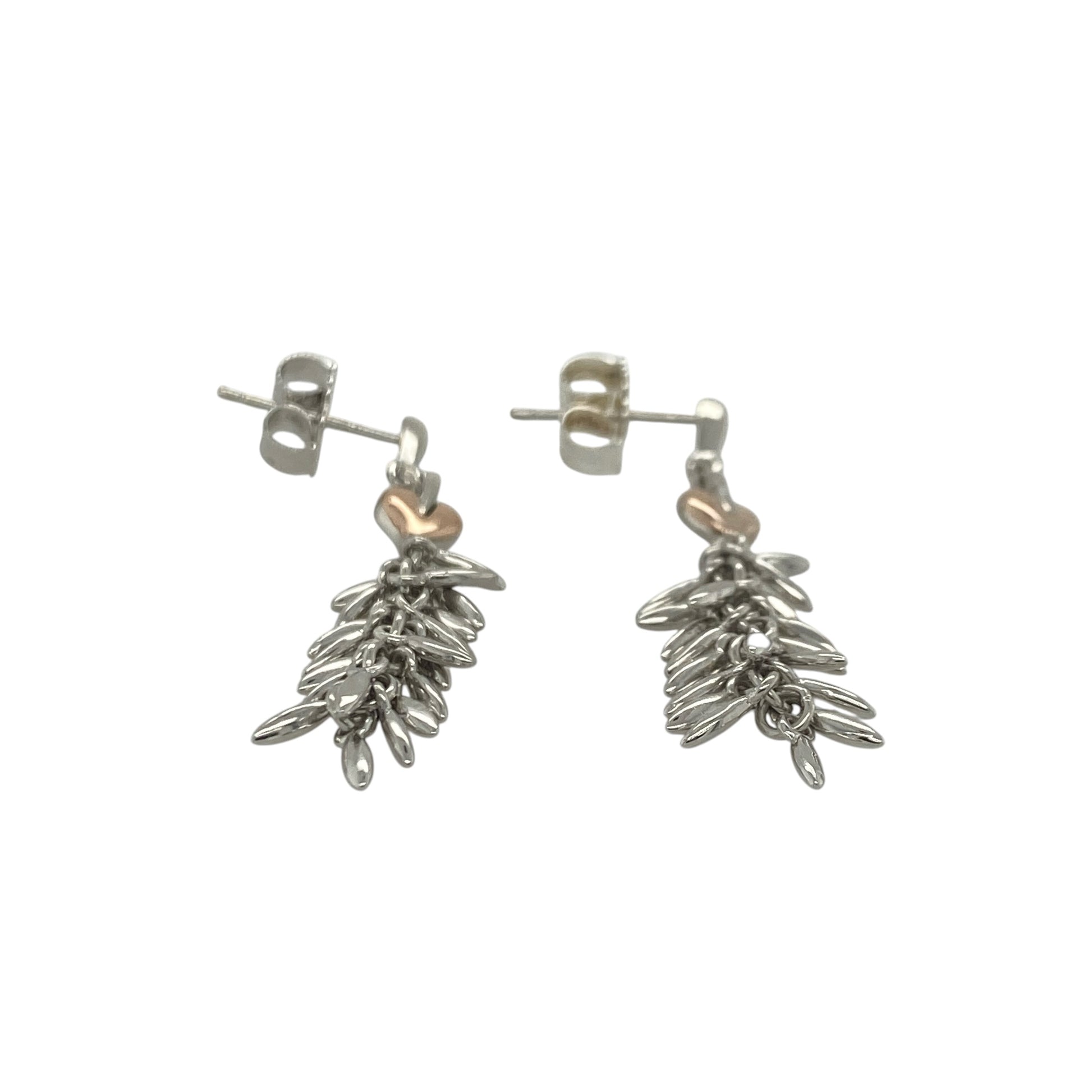 Add a touch of Welsh heritage and symbolic elegance to your jewellery collection with these pre-owned sterling silver and 9ct rose gold Clogau Tree of Life dangle drop earrings, featuring a beautifully detailed design with timeless appeal—perfect for gifting, special occasions, or refined everyday wear.

Design: The earrings showcase the iconic Tree of Life motif in an elegant dangle drop design, creating graceful movement and an eye-catching appearance when worn.