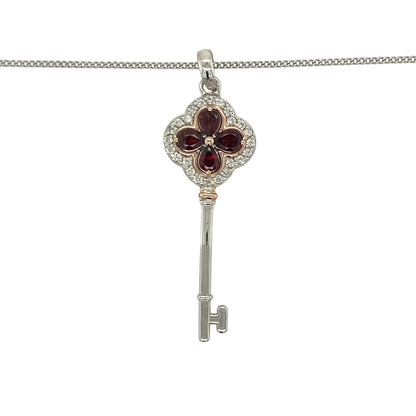 Add a touch of Welsh heritage and regal elegance to your jewellery collection with this pre-owned sterling silver, 9ct rose gold, garnet and white topaz Clogau Tudor Key pendant necklace, featuring a beautifully symbolic design with timeless appeal—perfect for gifting, special occasions, or meaningful everyday wear.

Design: The necklace features an intricately crafted Tudor Key pendant measuring approximately 4.2cm in length including the bail.