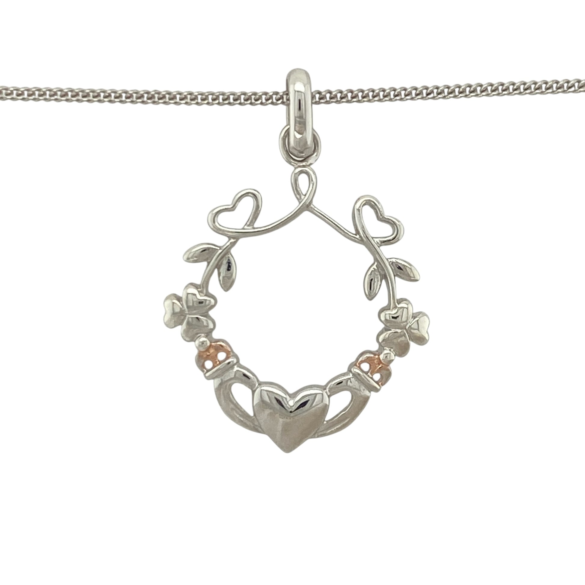 Add a touch of Celtic heritage and timeless romance to your jewellery collection with this pre-owned sterling silver and 9ct rose gold Clogau Claddagh wreath style pendant necklace, featuring a beautifully symbolic design with elegant everyday appeal—perfect for gifting, anniversaries, or meaningful daily wear.

Design: The necklace features an intricate Claddagh wreath style pendant measuring approximately 3.3cm in length including the bail.
