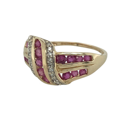 Add timeless elegance and rich colour to your jewellery collection with this pre-owned 9ct yellow gold diamond and ruby wrap around twist band ring, featuring a striking design with sophisticated everyday appeal—perfect for special occasions, gifting, or refined daily wear.

Design: The ring showcases an elegant wrap around twist design measuring approximately 11mm high at the front, creating a bold and eye-catching appearance.