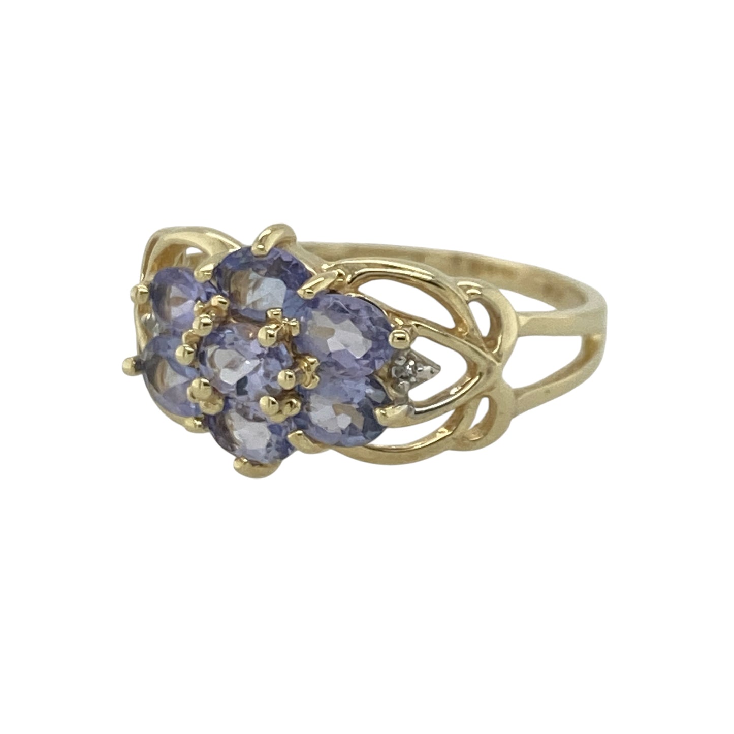 Add captivating colour and timeless sparkle to your jewellery collection with this pre-owned 9ct yellow gold diamond and tanzanite cluster ring, featuring an elegant gemstone design with sophisticated everyday appeal—perfect for special occasions, gifting, or refined daily wear.

Design: The ring showcases a beautiful tanzanite and diamond cluster measuring approximately 10mm high at the front, creating a striking focal point with vibrant violet-blue tones and exceptional sparkle.