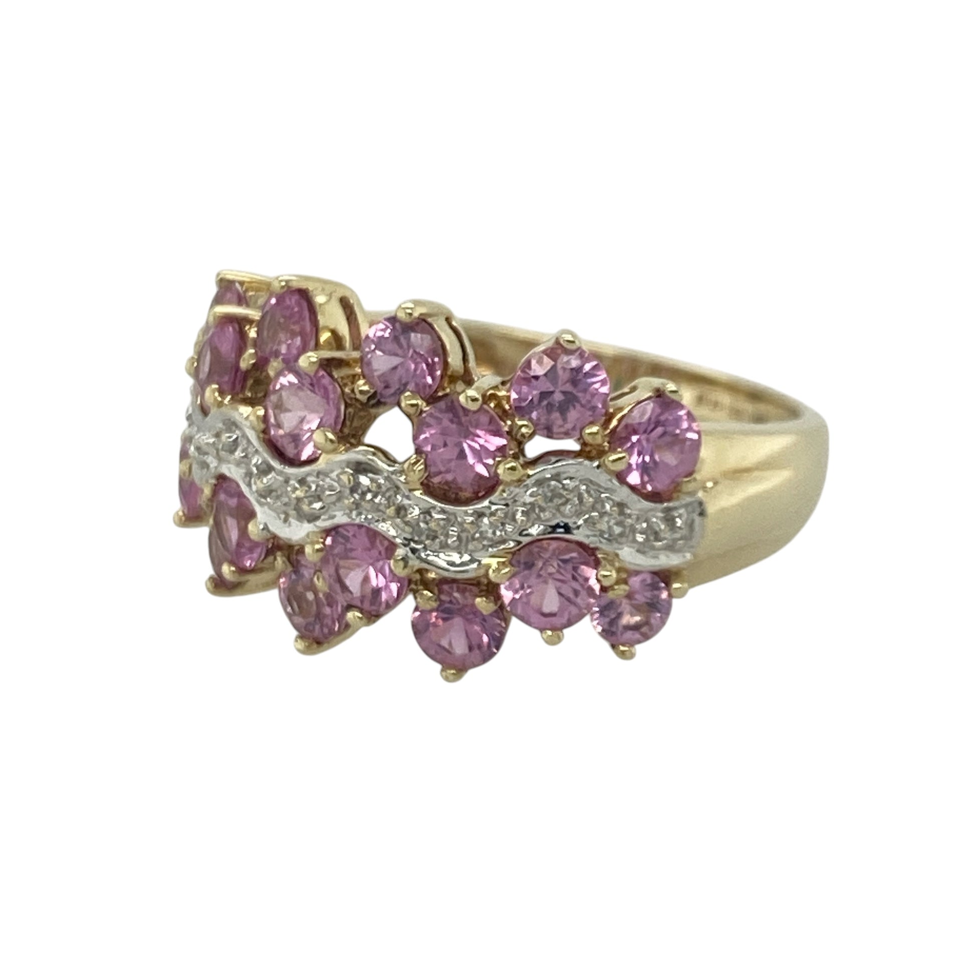 Add vibrant colour and luxurious sparkle to your jewellery collection with this pre-owned 9ct yellow gold diamond and pink sapphire cluster ring, featuring a striking floral-inspired design with elegant statement appeal—perfect for special occasions, gifting, or sophisticated everyday wear.

Design: The ring showcases a beautiful cluster design measuring approximately 12mm high at the front, set with vibrant pink sapphires, each approximately 3mm in diameter, complemented by sparkling diamond accents.