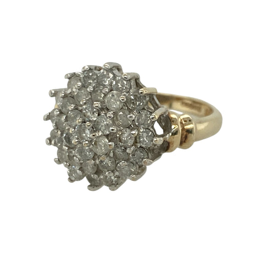 Add exceptional sparkle and timeless glamour to your jewellery collection with this pre-owned 9ct yellow gold diamond cluster ring, featuring a striking statement design with luxurious everyday appeal—perfect for special occasions, gifting, or elegant daily wear.

Design: The ring showcases an impressive diamond cluster measuring approximately 14mm high at the front, creating a bold and eye-catching focal point.