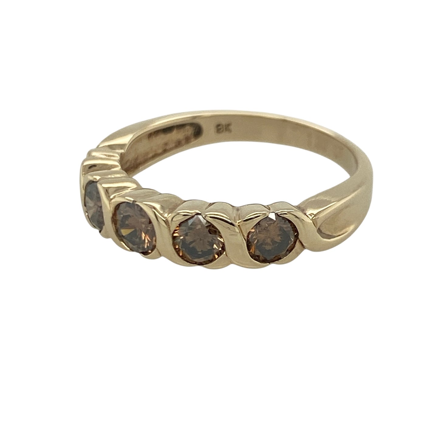 Add rich sparkle and distinctive elegance to your jewellery collection with this pre-owned 9ct yellow gold chocolate diamond five stone band ring, featuring a luxurious design with impressive everyday appeal—perfect for special occasions, gifting, or sophisticated daily wear.

Design: The ring showcases five beautiful chocolate diamonds arranged across the front of the band, creating a striking display of warm, natural colour and brilliance.