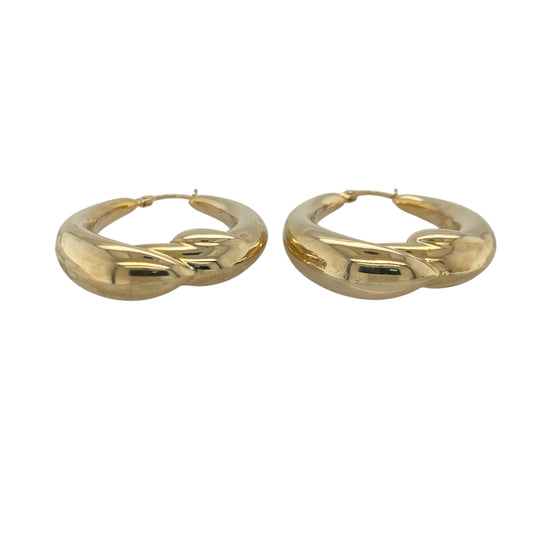 Add bold elegance and timeless style to your jewellery collection with these pre-owned 9ct yellow gold twist oval chunky creole earrings, featuring a striking design with versatile everyday appeal—perfect for special occasions, gifting, or making a statement with daily wear.

Design: The earrings feature a classic oval creole shape enhanced by an attractive twisted design, creating beautiful texture and light-catching detail.