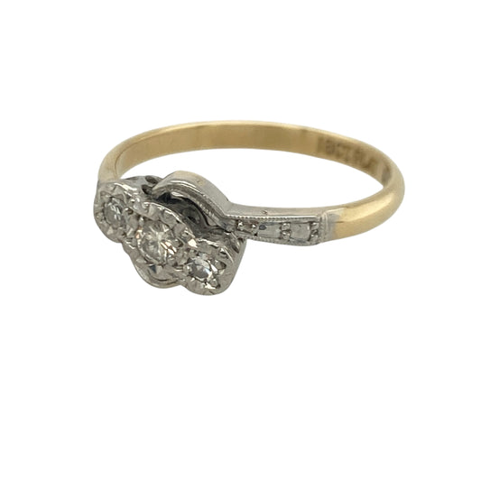 Add timeless elegance and meaningful sparkle to your jewellery collection with this pre-owned 18ct yellow gold and platinum diamond trilogy twist ring, featuring a graceful design with classic everyday appeal—perfect for anniversaries, special occasions, or sophisticated daily wear.

Design: The ring showcases a beautiful trilogy diamond arrangement set within an elegant twist design, creating a flowing and eye-catching appearance.