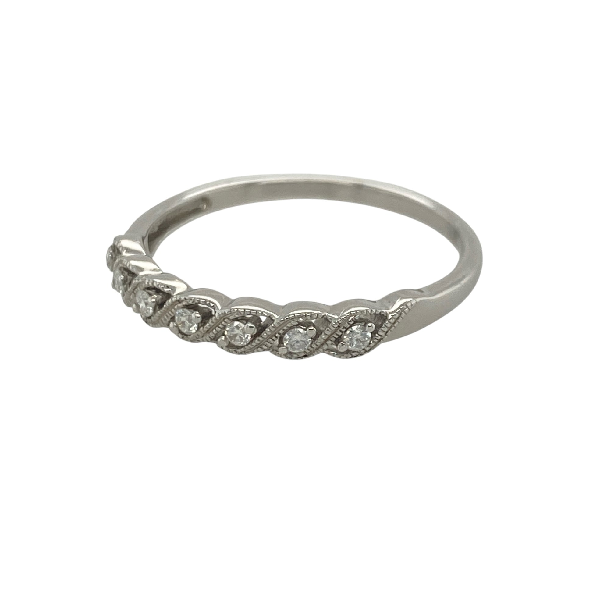 Add timeless sparkle and graceful elegance to your jewellery collection with this pre-owned 9ct white gold diamond twist band ring, featuring a beautifully flowing design with refined everyday appeal—perfect for anniversaries, stacking, special occasions, or sophisticated daily wear.

Design: The ring showcases an elegant twist band design measuring approximately 3mm wide at the front, creating a delicate flowing appearance across the finger.