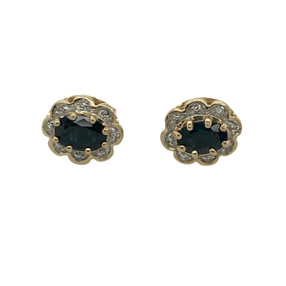 Add timeless elegance and vibrant colour to your jewellery collection with these pre-owned 9ct yellow gold diamond and sapphire cluster stud earrings, featuring a classic gemstone design with sophisticated everyday appeal—perfect for special occasions, gifting, or refined daily wear.

Design: The earrings showcase beautiful oval sapphire gemstones, each measuring approximately 6mm by 4mm, surrounded by sparkling diamond accents in an elegant cluster setting.